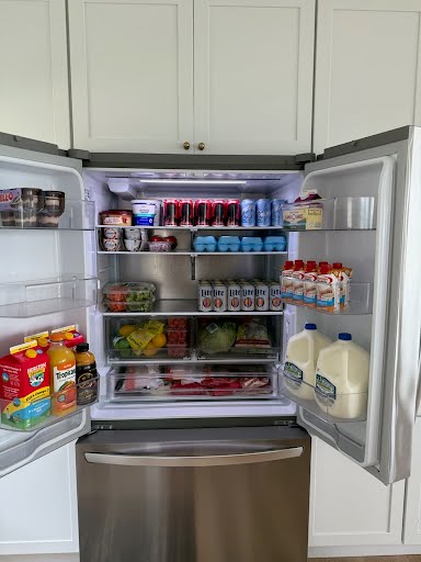 Stocked delivery fridge filled for arriving guests