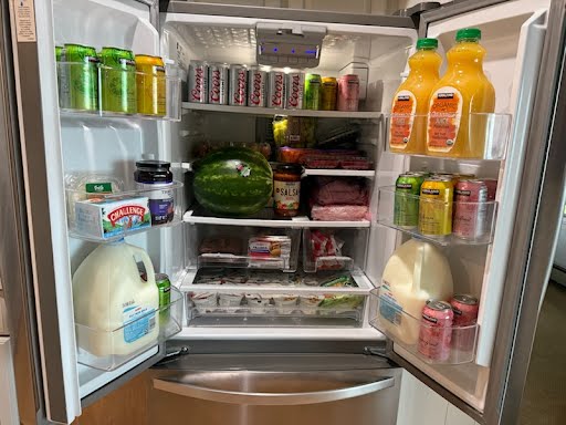 Stocked team staging food and beverages during delivery